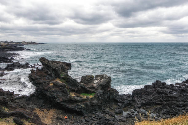 istock Yongduam Rock in Jeju 1084758008