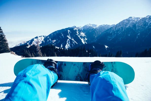 istock one snowboarder with snowboard on winter mountain top 1084760880