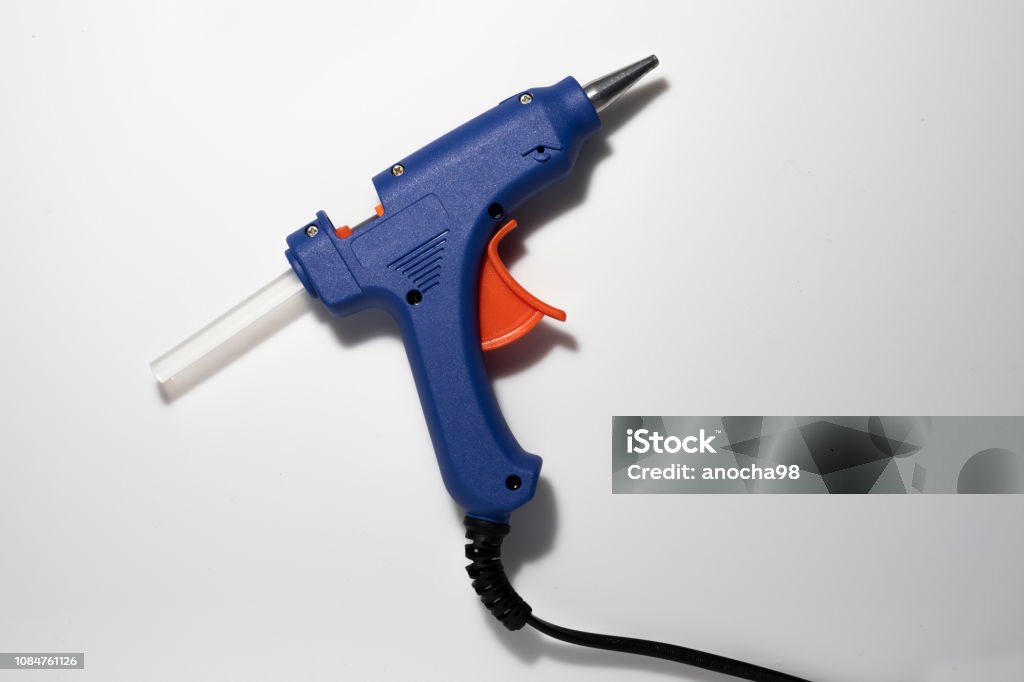 Glue gun blue isolated. Glue gun blue isolated on white background. Pistol Stock Photo