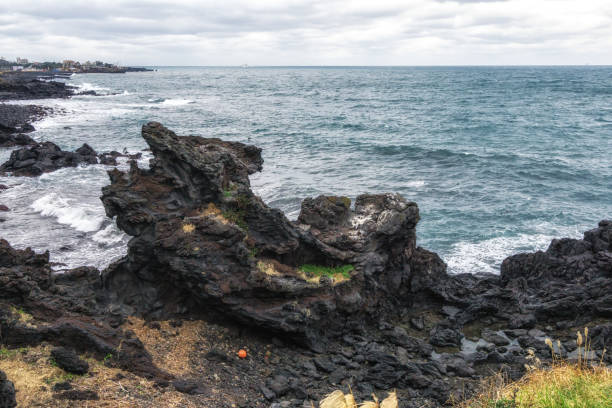 istock Yongduam Rock in Jeju 1084762596