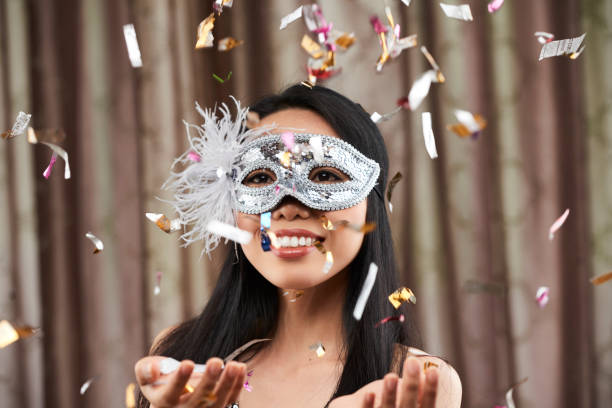 istock Woman standing in confetti rain 1084768060