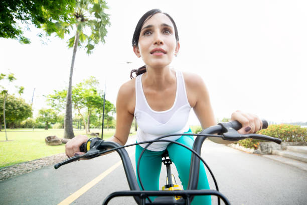 istock Focused woman riding a bike 1084773810