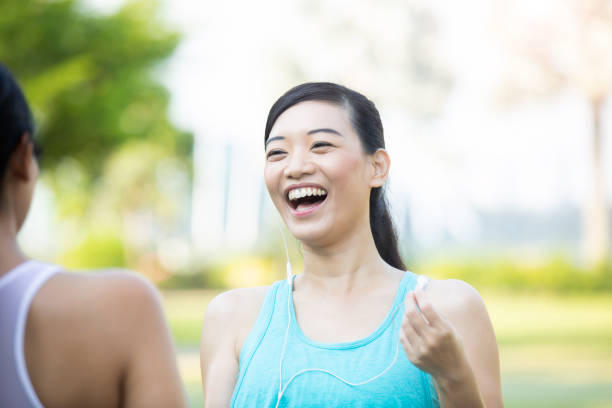 istock Woman laughs while talking with a friend 1084773854