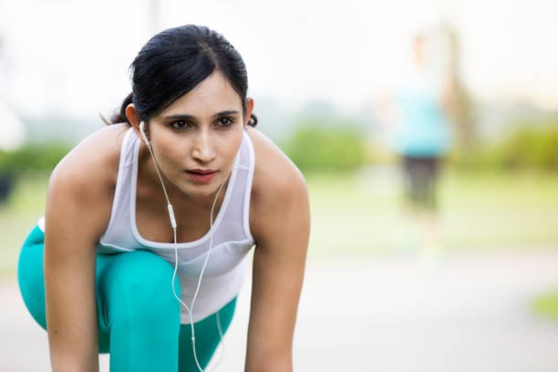 istock Focused woman prepares for race 1084773876