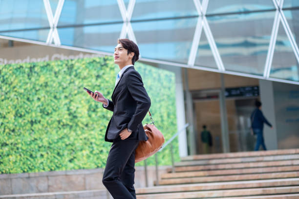 istock Young businessman using his smartphone on the street 1084774060