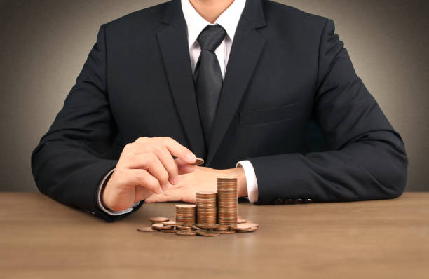 istock human hand putting coin to money 1084778396