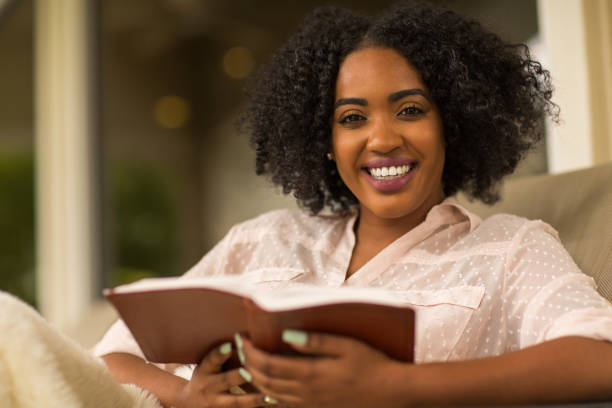 istock Happy woman reading. 1084788112