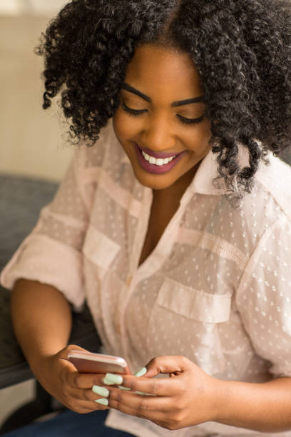 istock African American woman texting. 1084788178