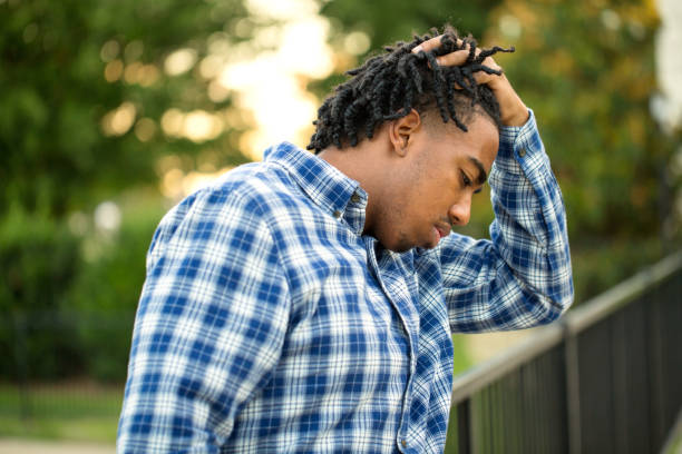 istock Young African American man in deep thought. 1084790382