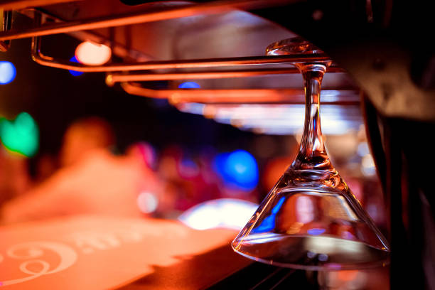 istock Empty glasses for wine above a bar rack in vintage tone. 1084793788