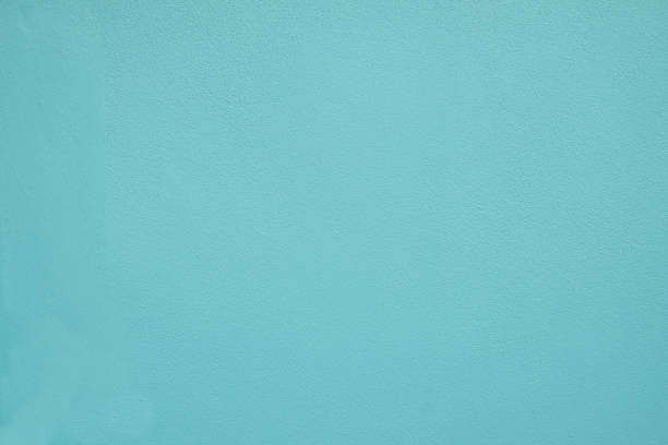 istock Green pastel painted wall texture. rough plaster background with copy space for design 1084795428