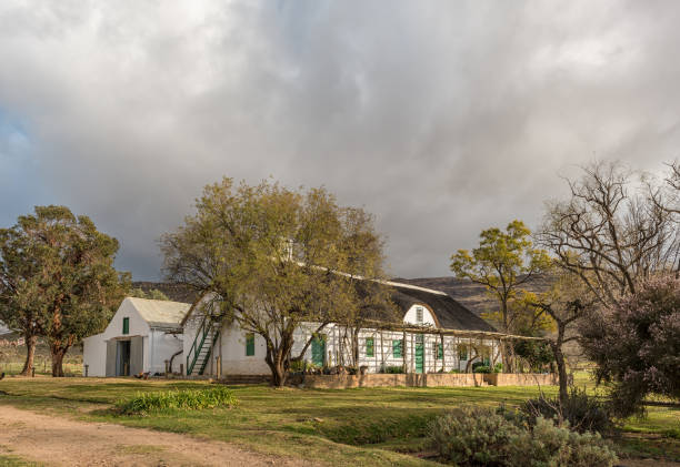 KROMRIVIER, SOUTH AFRICA, AUGUST 25, 2018: An historic farm house and barn at Kromrivier Cederberg Park, a holiday resort in the Cederberg Mountains