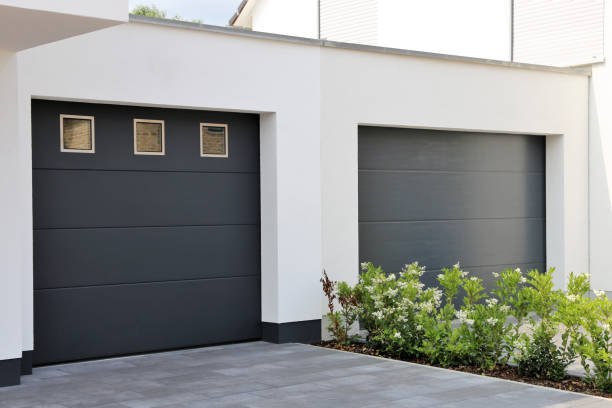 istock Two modern new garage doors (sectional doors) in a residential district 1084810370