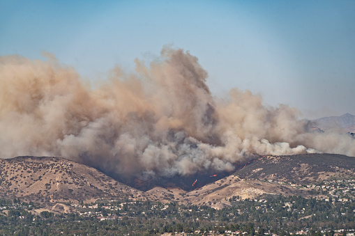 A snapshot of a wildfire burning in the hills of an Orange County suburb in Southern California.