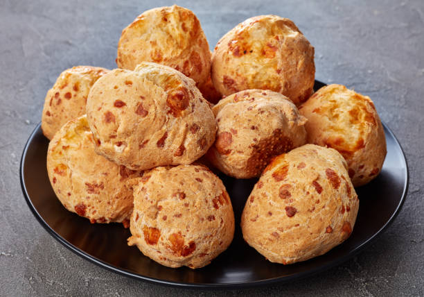 istock cheese puffs balls on a black plate 1084816332