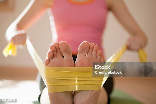 Woman Exercising With Resistance Bands Stock Photo - Download Image Now - Resistance Band, Domestic Life, Exercising