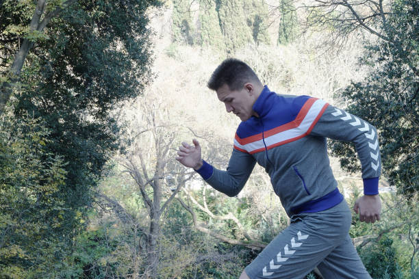 Sports Man Running at forest