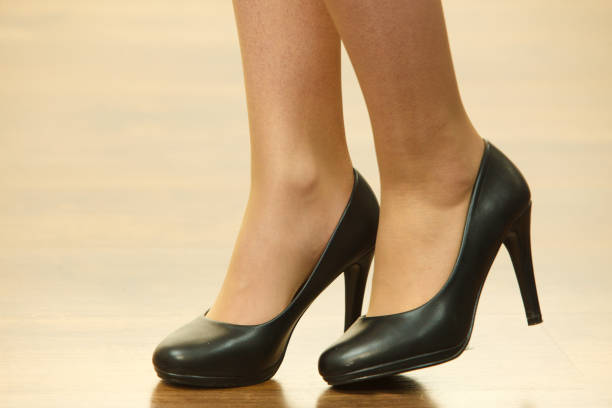 istock Unrecognizable woman wearing high heels 1084825874