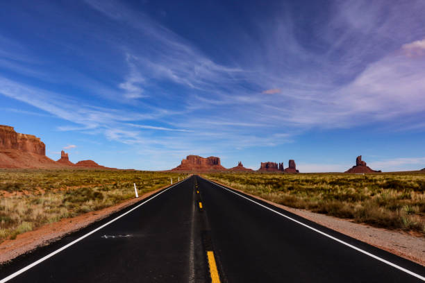 istock Arizona desert road and large cliffs region 1084829130