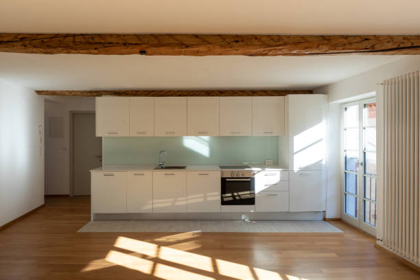 istock Empty room with parquet and window overlooking the castle 1084831580