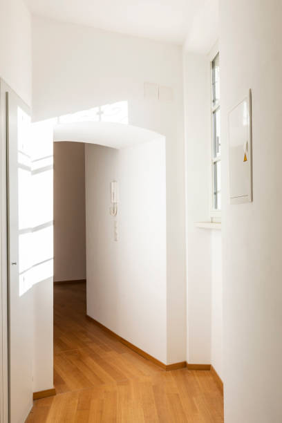 istock Empty room with parquet and window overlooking the castle 1084831790