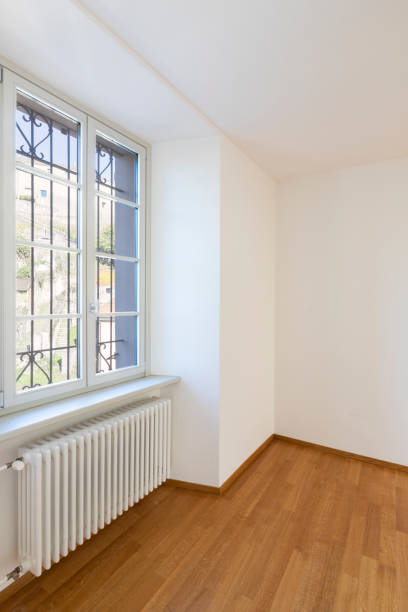 istock Empty room with parquet and window overlooking the castle 1084832088