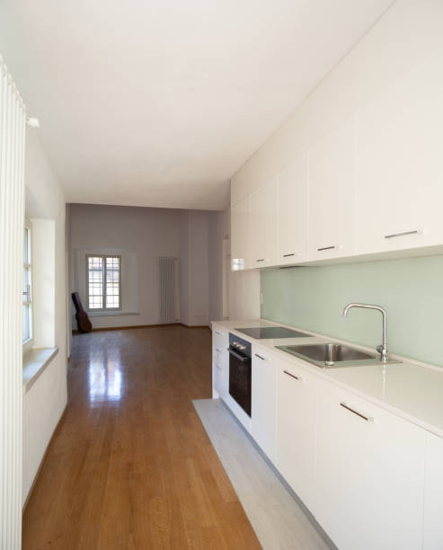 istock Empty room with parquet and window overlooking the castle 1084832318