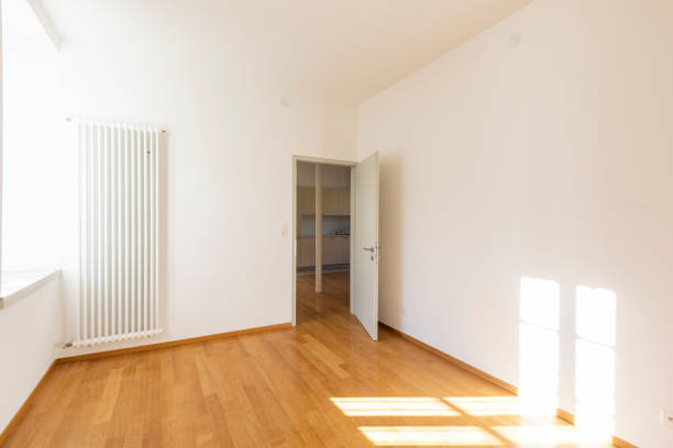 istock Empty room with parquet and window overlooking the castle 1084832344