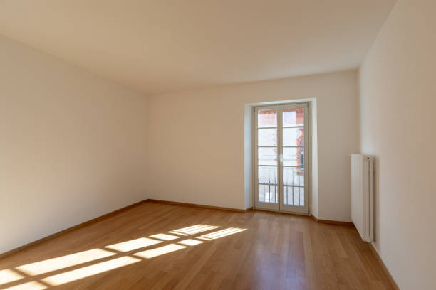 istock Empty room with parquet and window overlooking the castle 1084832650
