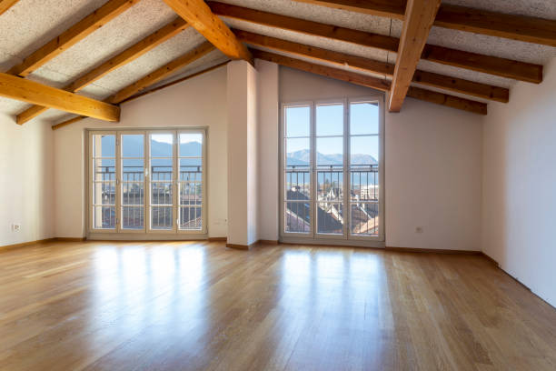 istock Empty room with parquet and window overlooking the castle 1084834160