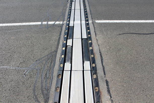 istock Highly used worn out metal and rubber bridge segments connection 1084834418