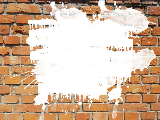 istock grunge aged brick wall with white ink splatter splash drops background 1084836136
