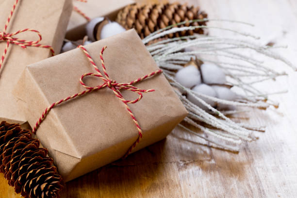 istock craft christmas presents on wooden background 1084836498
