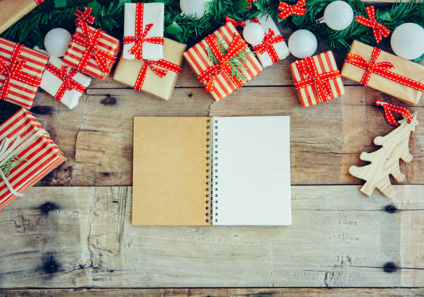 istock Christmas background with decorations and red gift boxes on the wooden board 1084843290