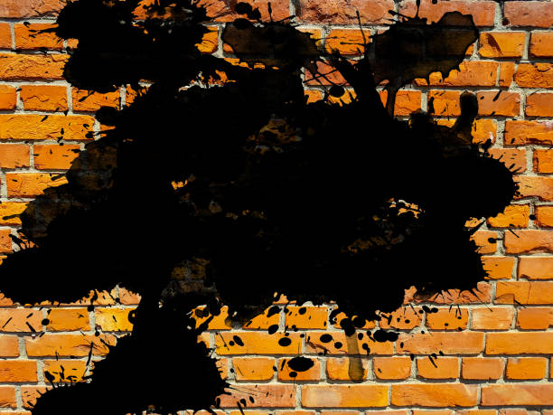 istock grunge aged brick wall with black ink splatter splash drops brush stroke art abstract background empty blank design element 1084844268