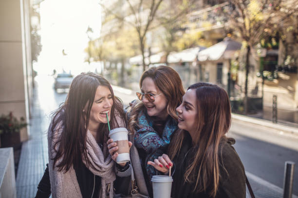 istock Friends walking and having fun in the city 1084845532