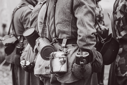 Container for gas mask bowler and flask for drinking on the Wehrmacht soldier in a uniform since the Second World War. Black and white photography