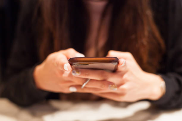 istock Woman using smart mobile phone on the table, Shopping and Communicating with digital technology. Modern Trend, Lifestyle, Business Transaction, Communication, Artificial Society and Mobile App concept 1084850840