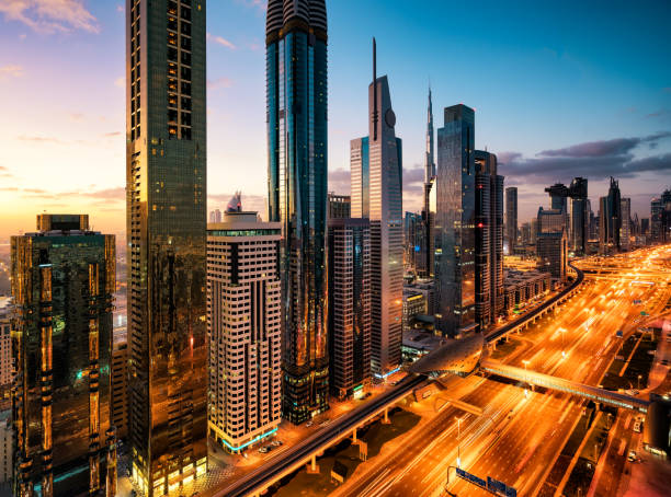 istock Dubai skyline at sunrise with illuminated road 1084851162