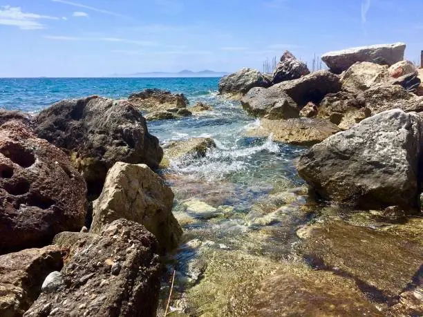 Rocks in the Aegean sea.Athens. Blue sky,rock and water