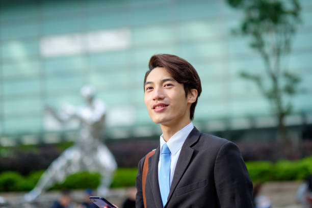 istock Young businessman using his smartphone on the street 1084858654