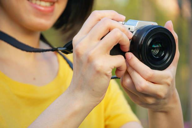 istock Tourism woman use camera take a photo 1084862436