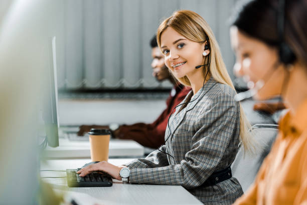 istock multicultural call center operators with headsets at workpalce in office 1084862906
