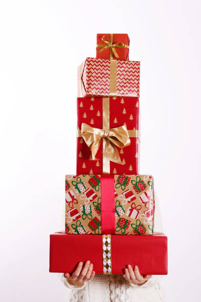 istock Young woman holding colorful present. 1084864572