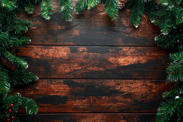 istock Christmas background with fir tree and decoration on rustic wooden table 1084864862