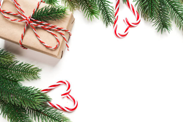 istock Christmas vintage gift with candy and tree isolated on white background 1084864974
