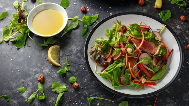 istock Spicy Beef Salad with Carrots, radish, bean sprouts, chilli, nuts and green mix 1084865164