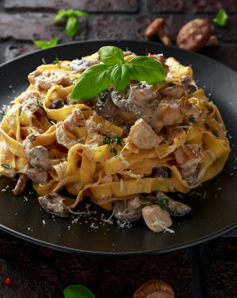istock Pasta with shiitake mushrooms and chicken with herbs and cheese 1084865196