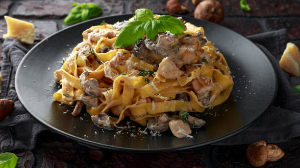 istock Pasta with shiitake mushrooms and chicken with herbs and cheese 1084865232