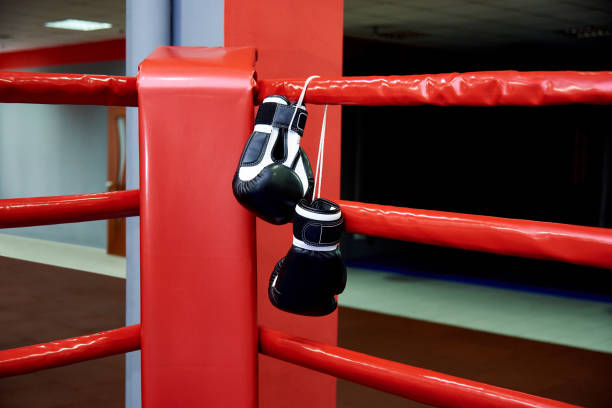 istock Boxing gloves on boxing ring in gym 1084870032